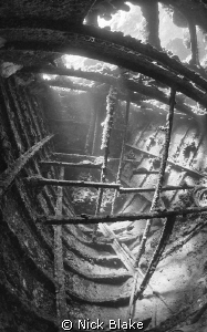 A shot inside the tug boat wreck, Red Sea by Nick Blake 
